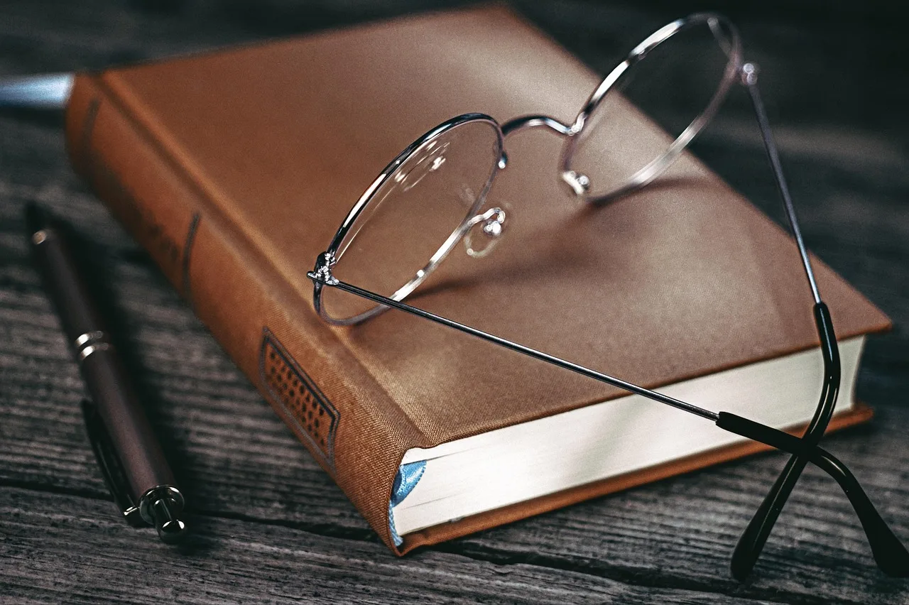 glasses, notebook, diary, pen, workspace, table. Customer interview answers: the one follow-up that makes them count