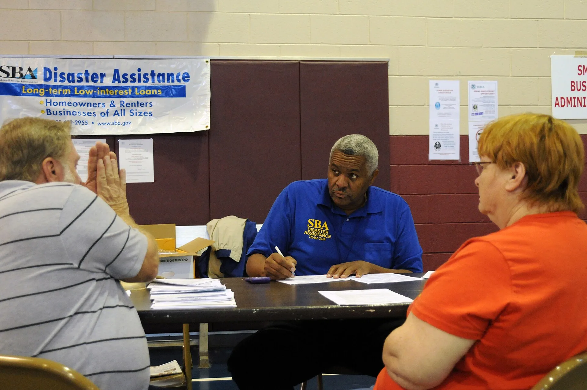 Woodstock, GA, October 1, 2009 -- At the Cherokee County State/FEMA Disaster Recovery Center, Small Business Administration Customer Service Representative, James McQueen listens to a flood affected resident. Small Business Administration low interest loans can help recovery for those affected by th. Customer interview mistakes in recruiting and booking